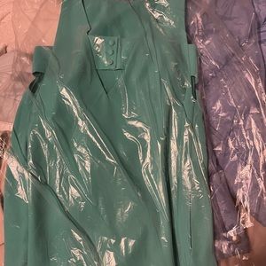 BRAND NEW teal summer dress. Button design on back. Sleeveless and so flowy.